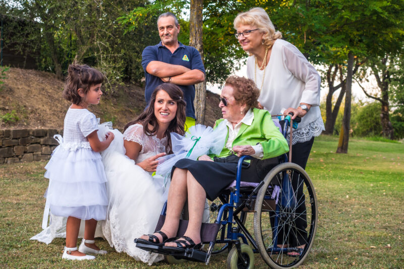 A woman in a wheelchair with two little girls.